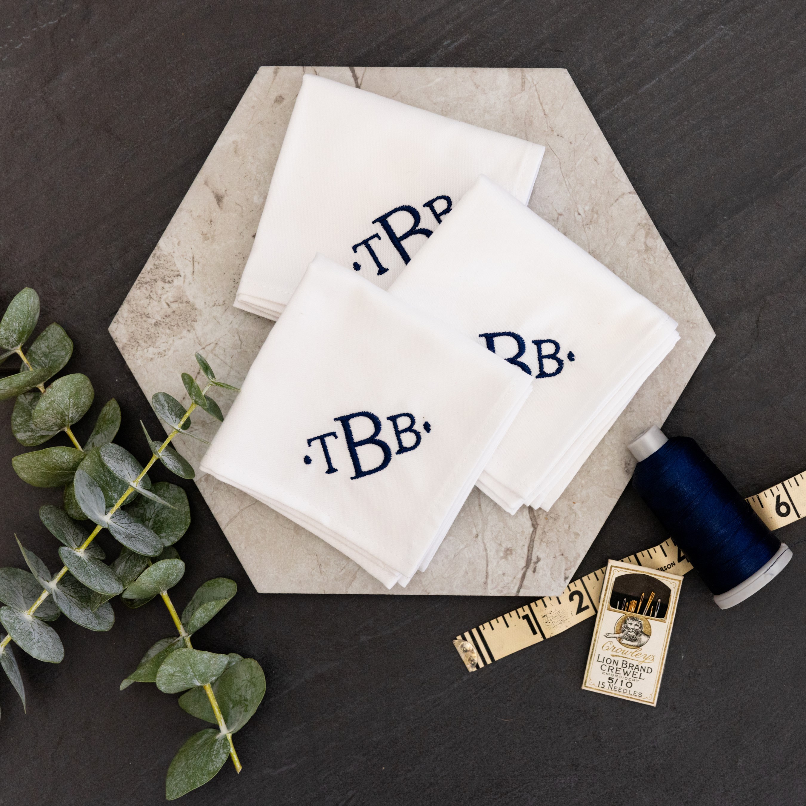 Embroidered monogrammed handkerchiefs for men with a navy timeless monogram.